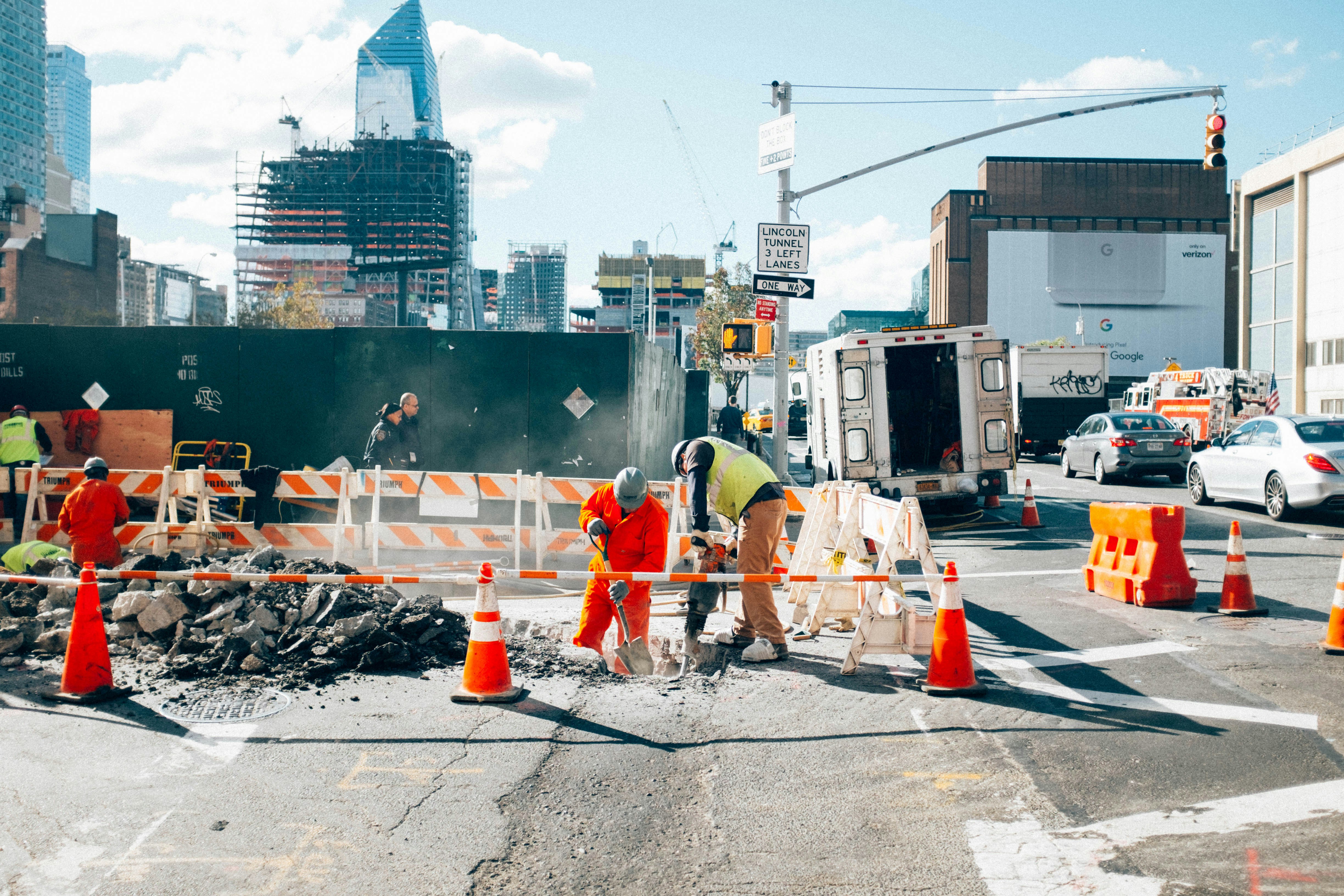 Busy construction site with workers wearing PPE to avoid workplace accidents